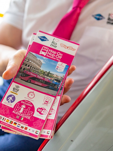Brochure for I Love Rome Hop-On Hop-Off Tour featuring Colosseum and bus image.
