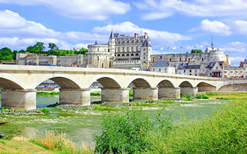 Pont D Amboise spanning the Loire River with Château d'Amboise in the background, France.