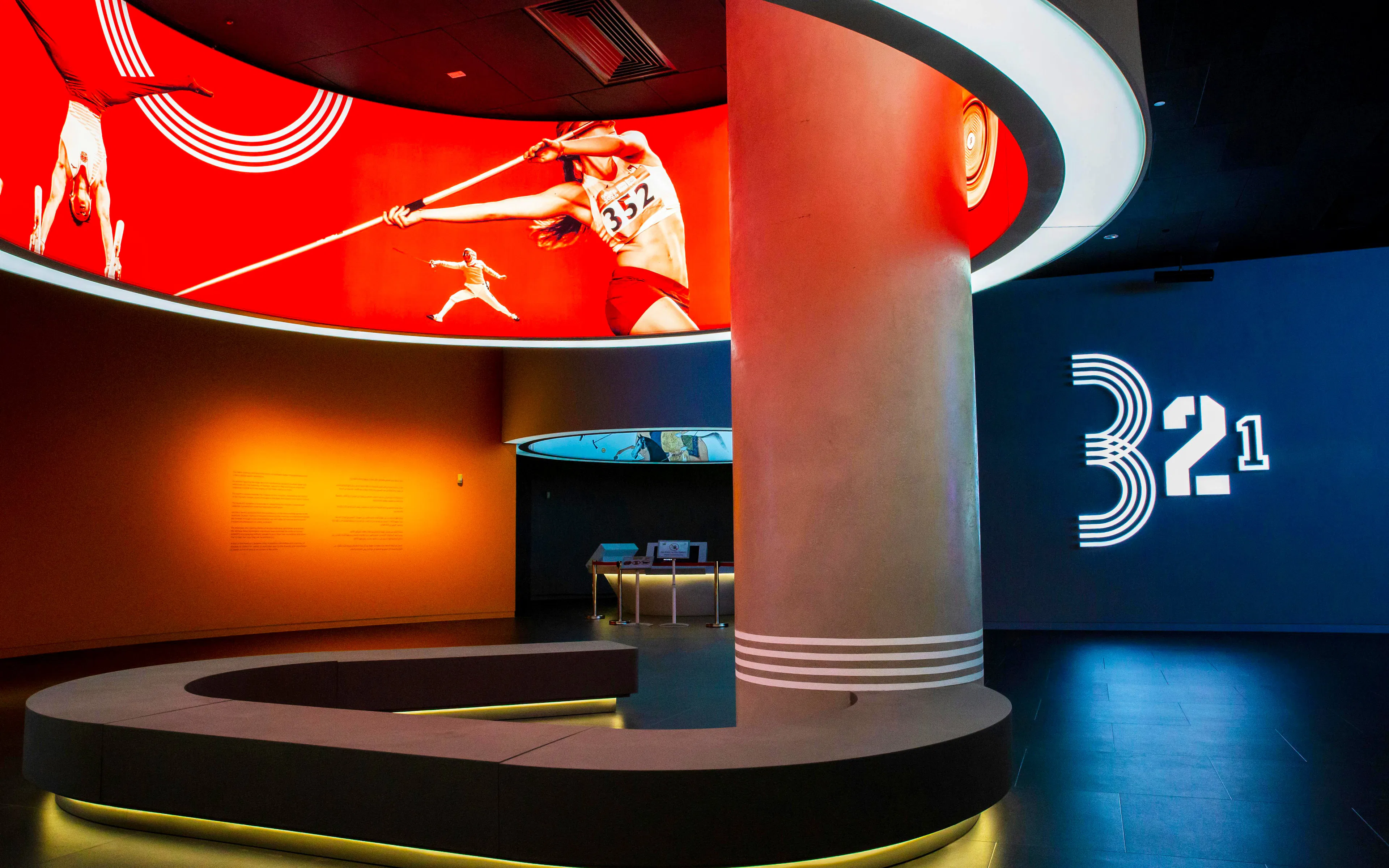 Interior of Qatar Olympic and Sports Museum with sports-themed displays and modern design.