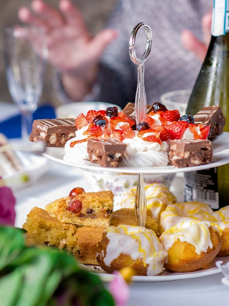 Afternoon tea with prosecco, cakes, and pastries at the British Museum.
