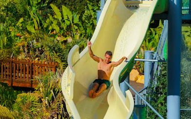Tourist sliding down waterslide at Zoomarine Algarve.