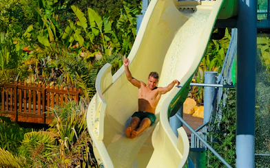 Tourist sliding down waterslide at Zoomarine Algarve.