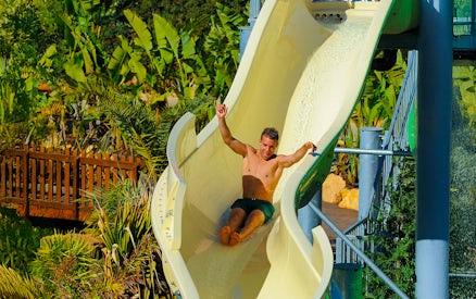 Tourist sliding down waterslide at Zoomarine Algarve.