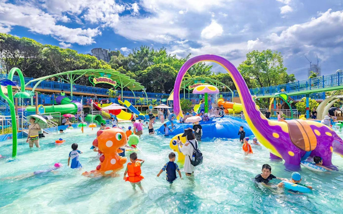 Children enjoying water rides at Window of the World theme park in Shenzhen, China.
