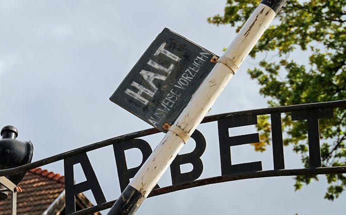 Entrance gate sign at Auschwitz concentration camp, part of Krakow and Auschwitz day tour from Warsaw.