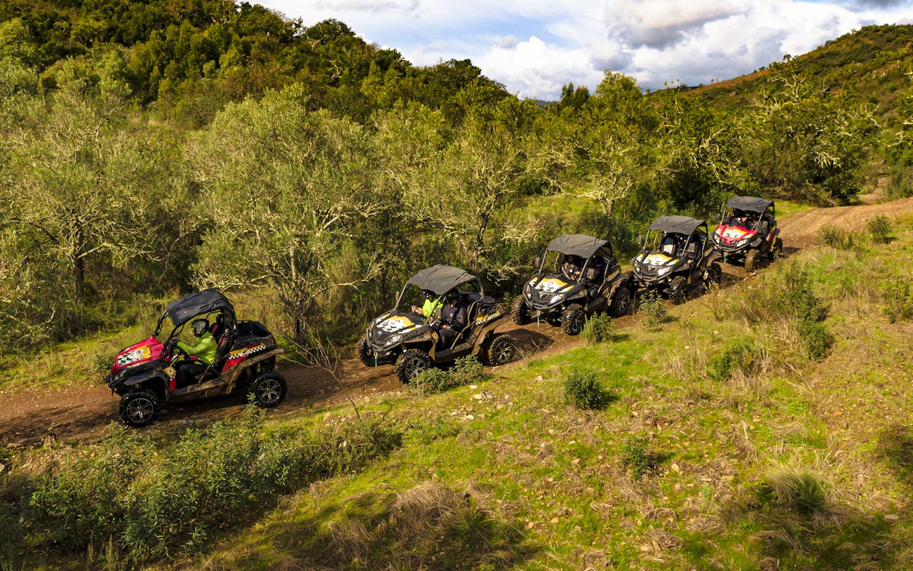 Buggies driving through a scenic trail in Algarve, Portugal.