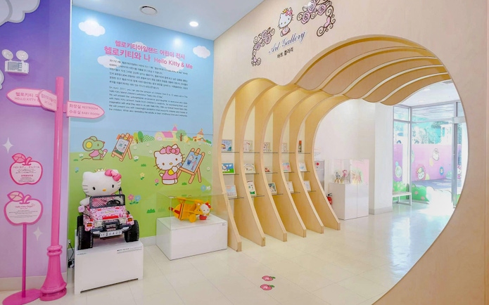 Hello Kitty Island interior with art gallery and colorful displays.