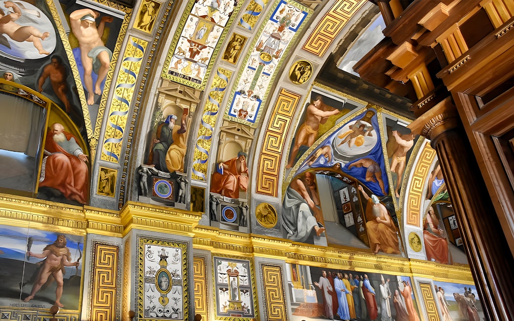 Ceiling frescoes in San Lorenzo de El Escorial, depicting biblical scenes and figures.