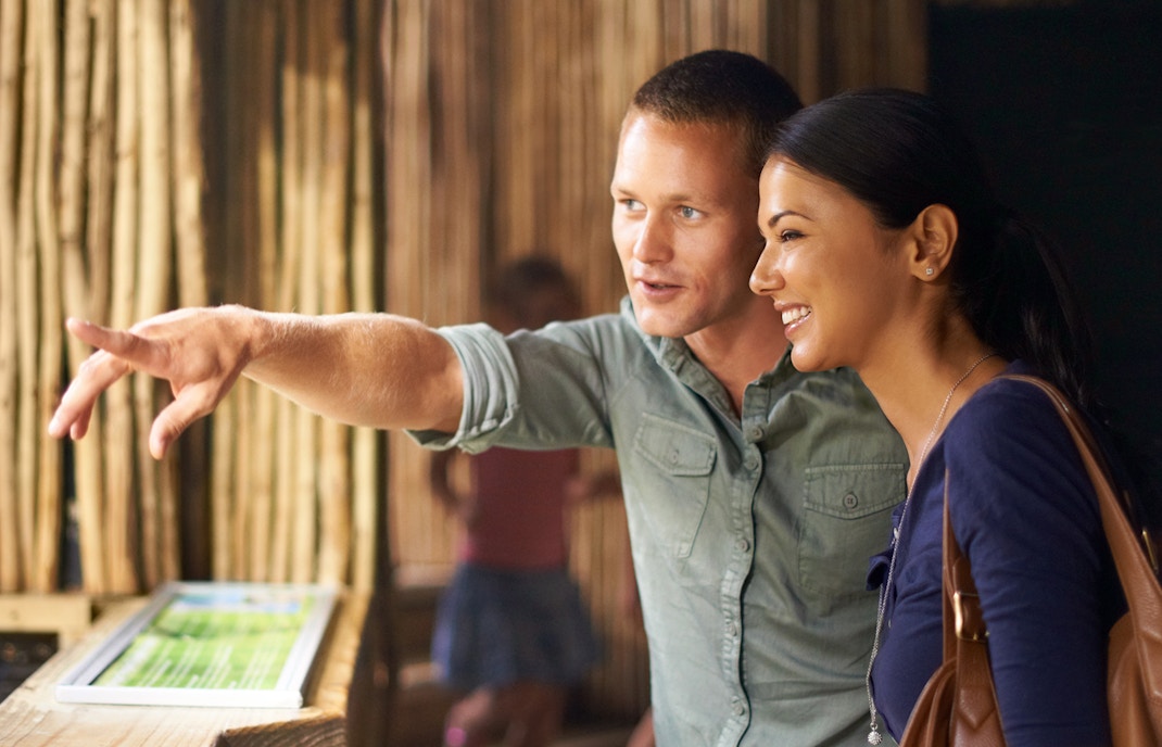 Guide of Valencia Zoo, observing wildlife exhibits.