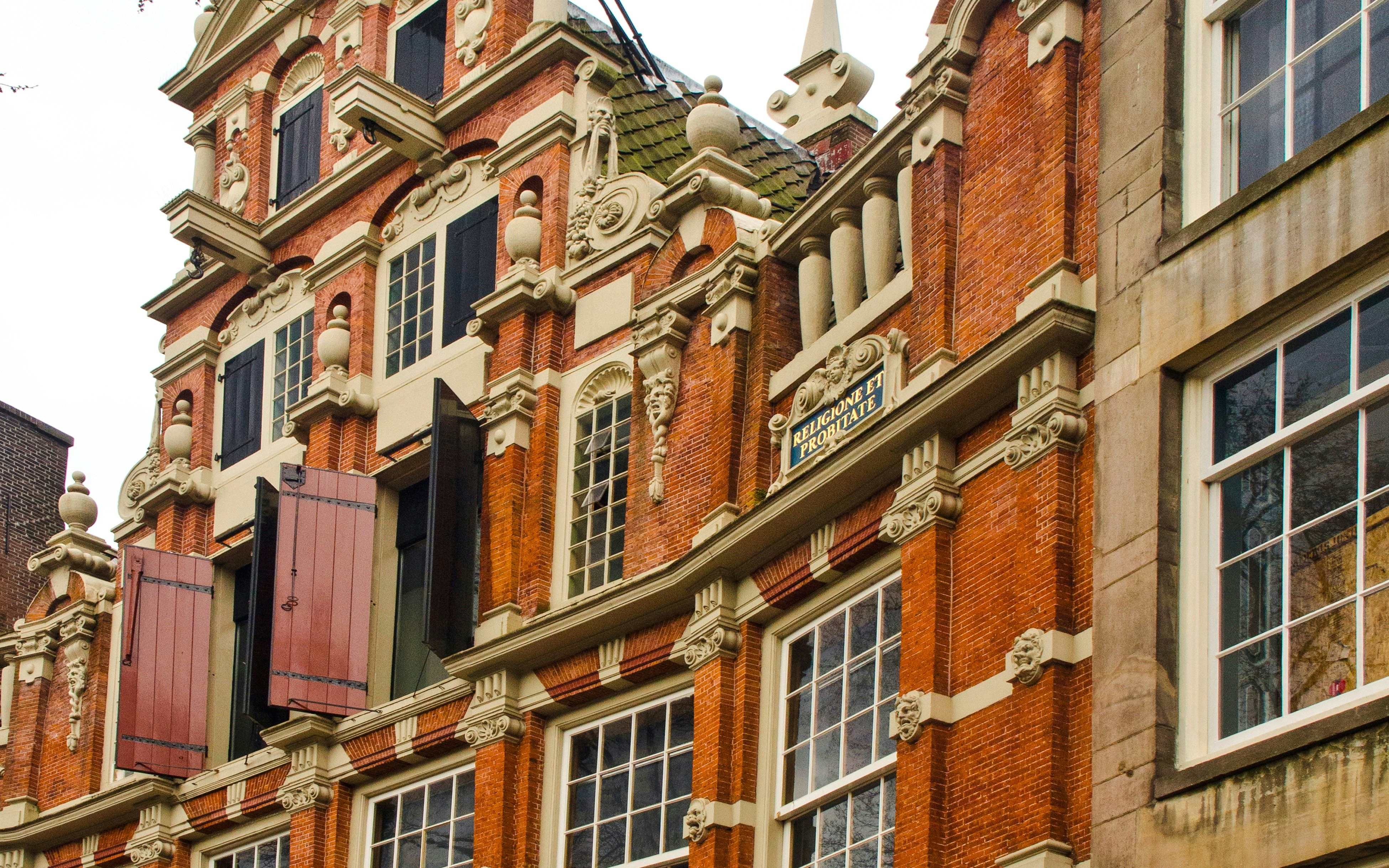 Bartolotti House facade with ornate brickwork and decorative elements in Amsterdam.