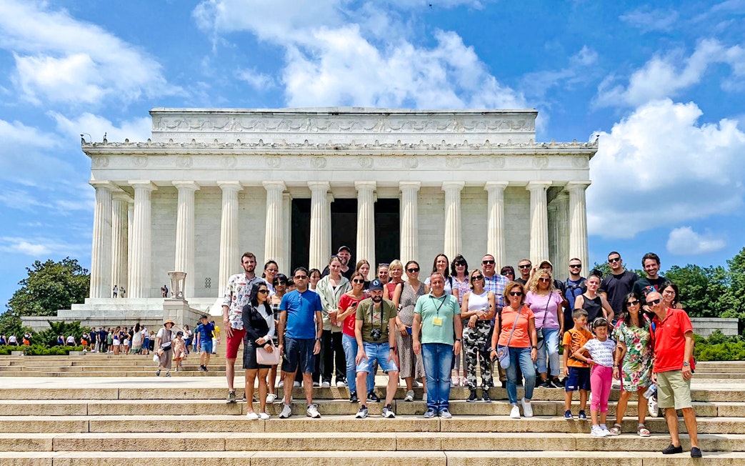 Guests in front of the Lincoln Memorial during New York City to Washington DC day trip.