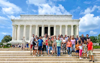 Guests in front of the Lincoln Memorial during New York City to Washington DC day trip.