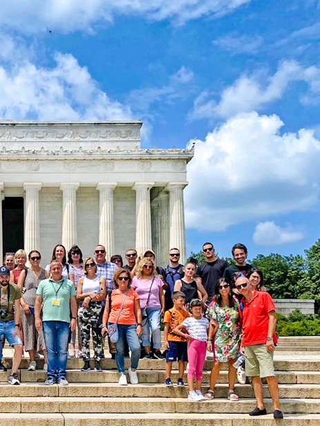 Guests in front of the Lincoln Memorial during New York City to Washington DC day trip.