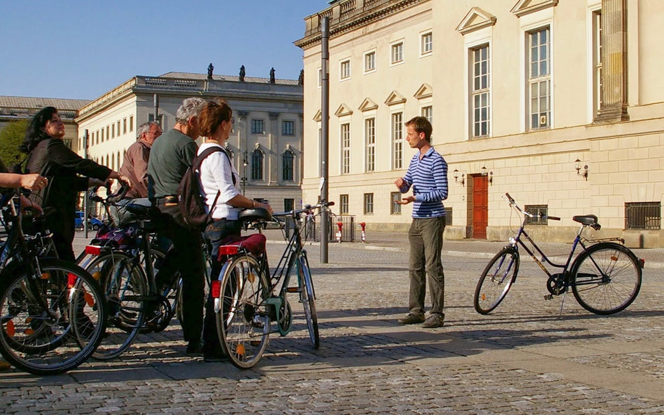 Guide explaining on bike tour