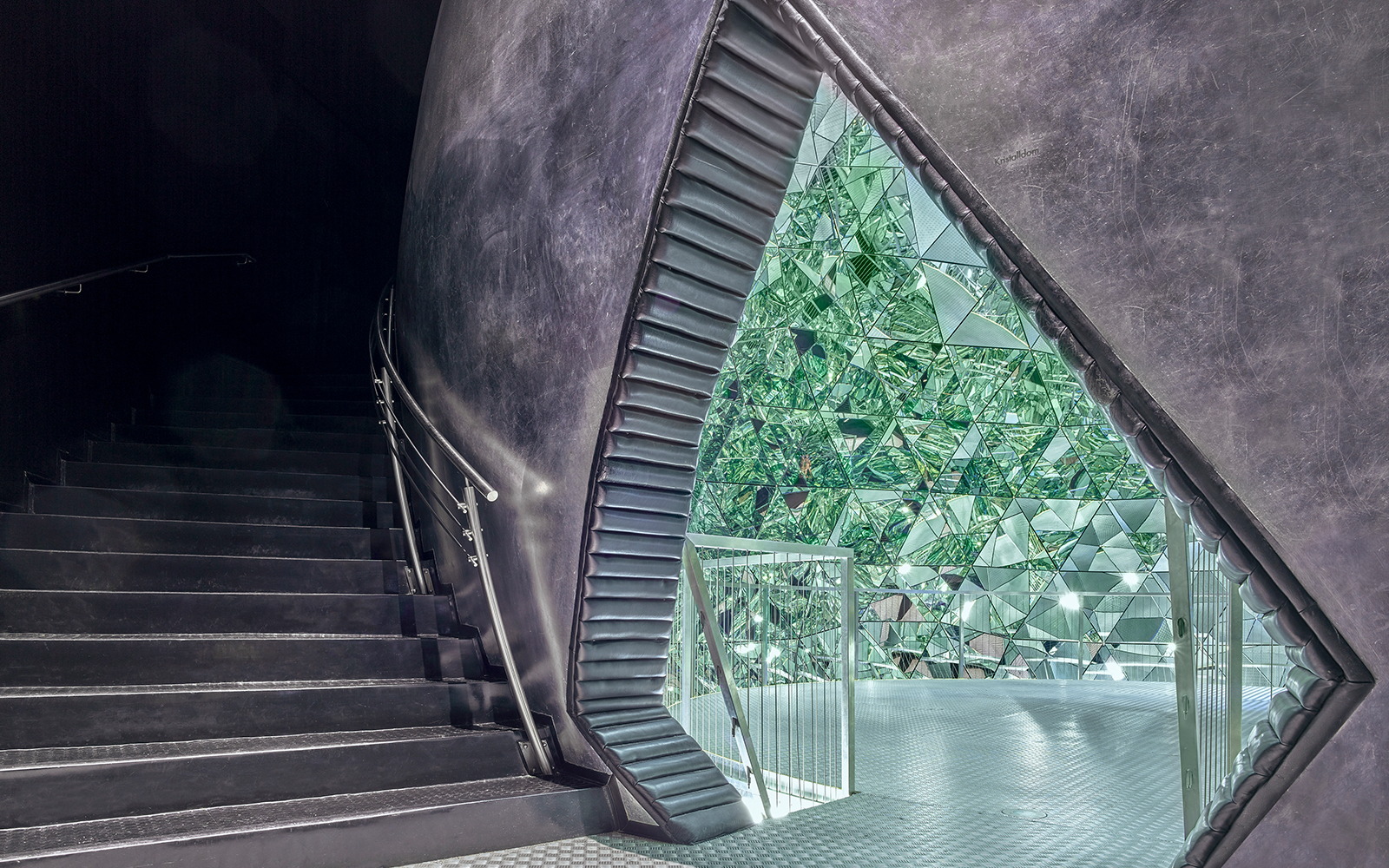 Staircase leading to a mirrored crystal installation at Swarovski Crystal Worlds.