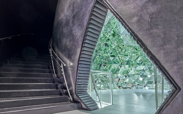 Staircase leading to a mirrored crystal installation at Swarovski Crystal Worlds.