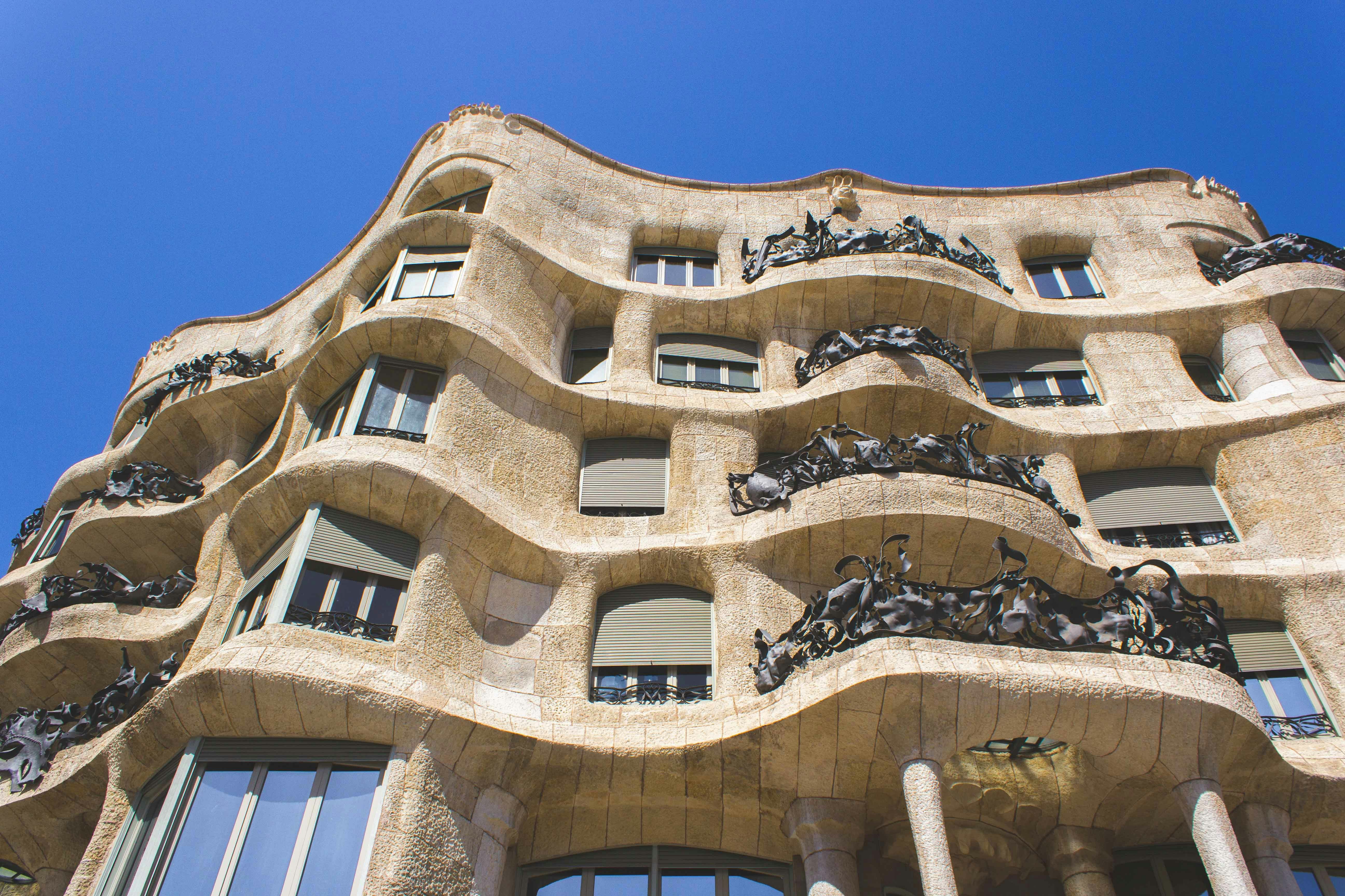 Casa Mila's wavy stone facade with intricate ironwork in Barcelona.