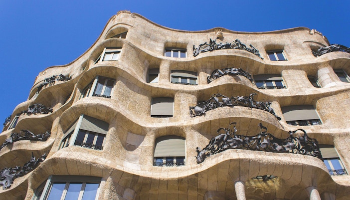 Casa Mila's wavy stone facade with intricate ironwork in Barcelona.