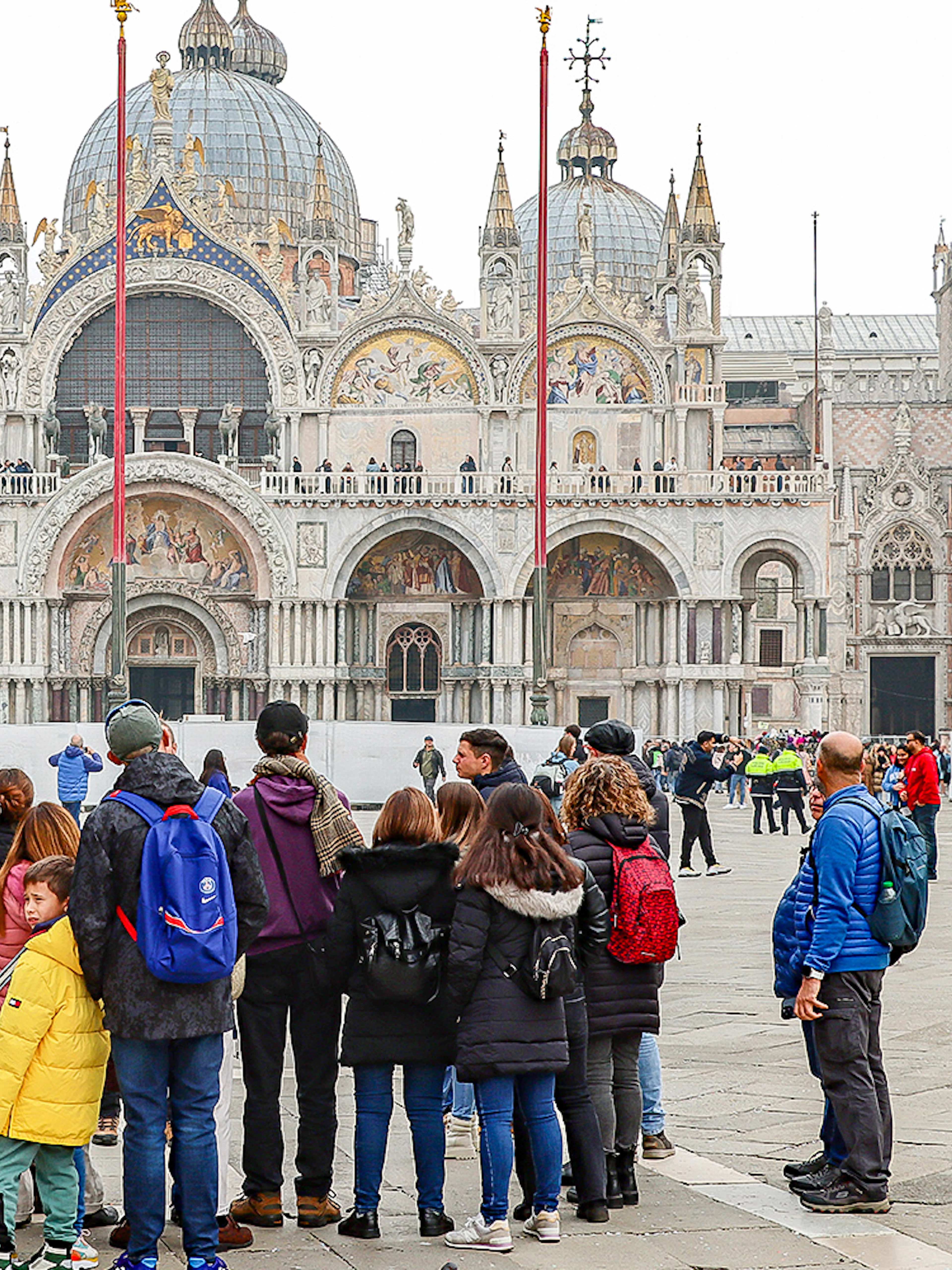 Tour group in front of St. Mark's Basilica, Venice, during a guided walking tour.