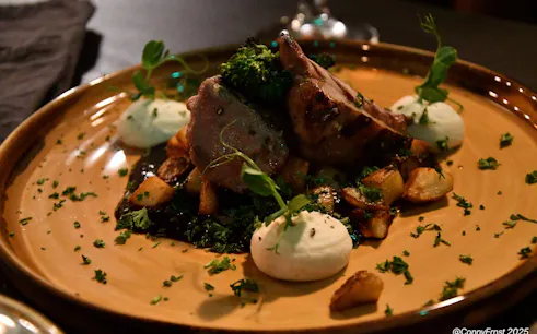 Grilled lamb with potatoes and herbs at a private Icelandic dining experience.