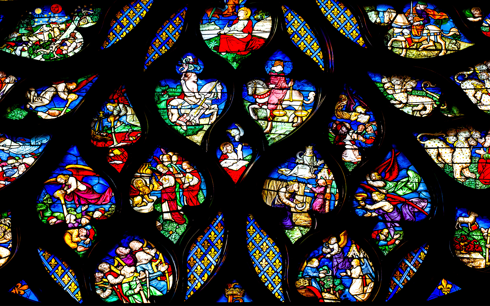 Saint Chapelle rose window with intricate flame-like motifs in Paris, France.