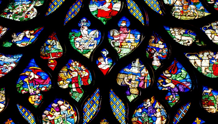 Saint Chapelle rose window with intricate flame-like motifs in Paris, France.
