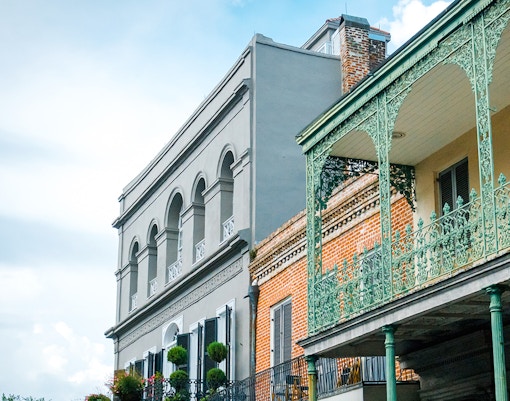 Historic architecture with wrought iron balconies in the French Quarter, New Orleans.