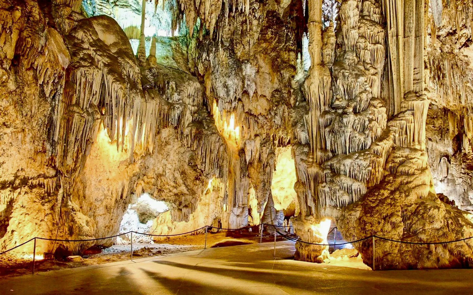 Stalactites and stalagmites in the illuminated Caves of Nerja, Spain.
