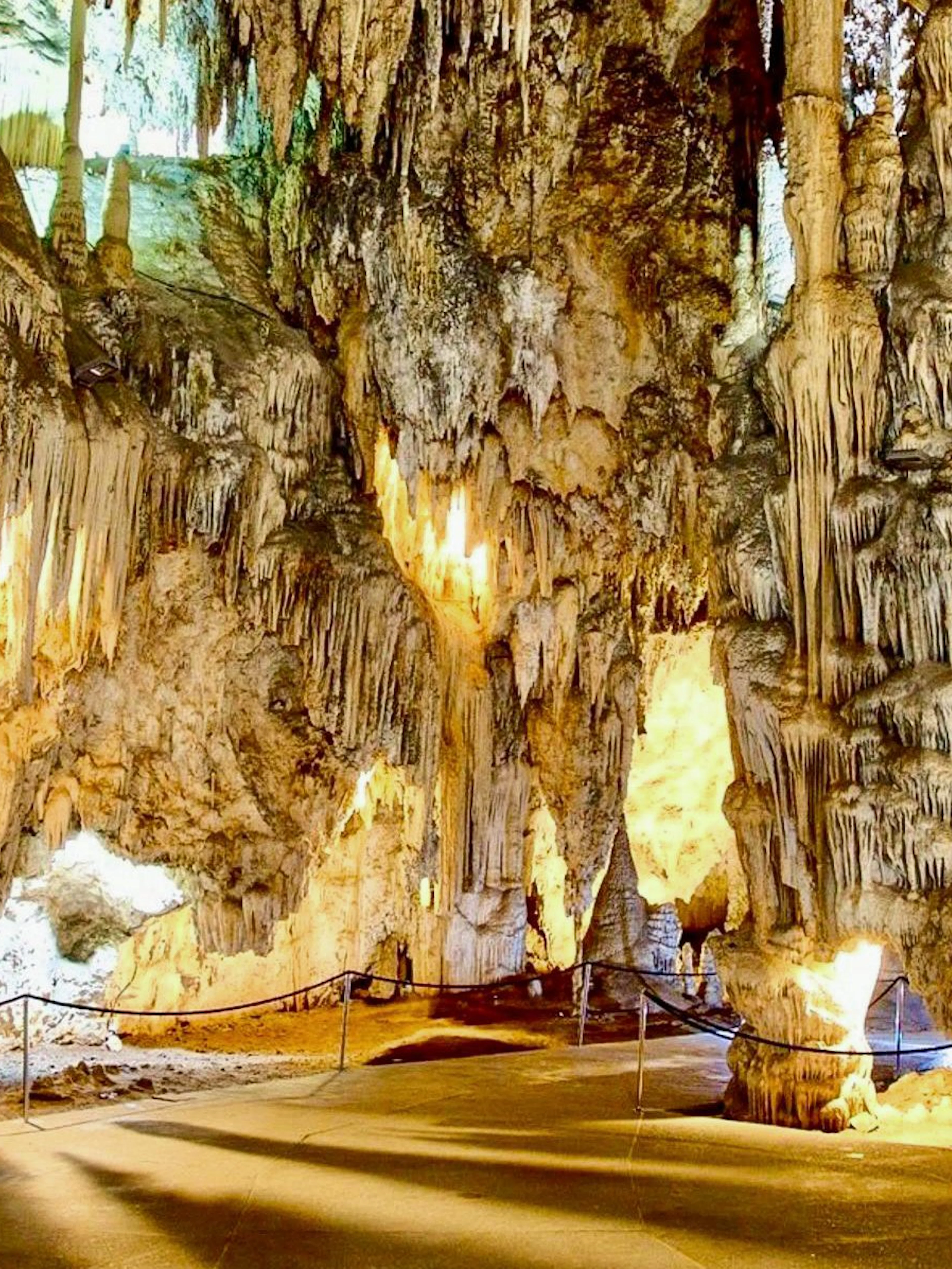 Stalactites and stalagmites in the illuminated Caves of Nerja, Spain.