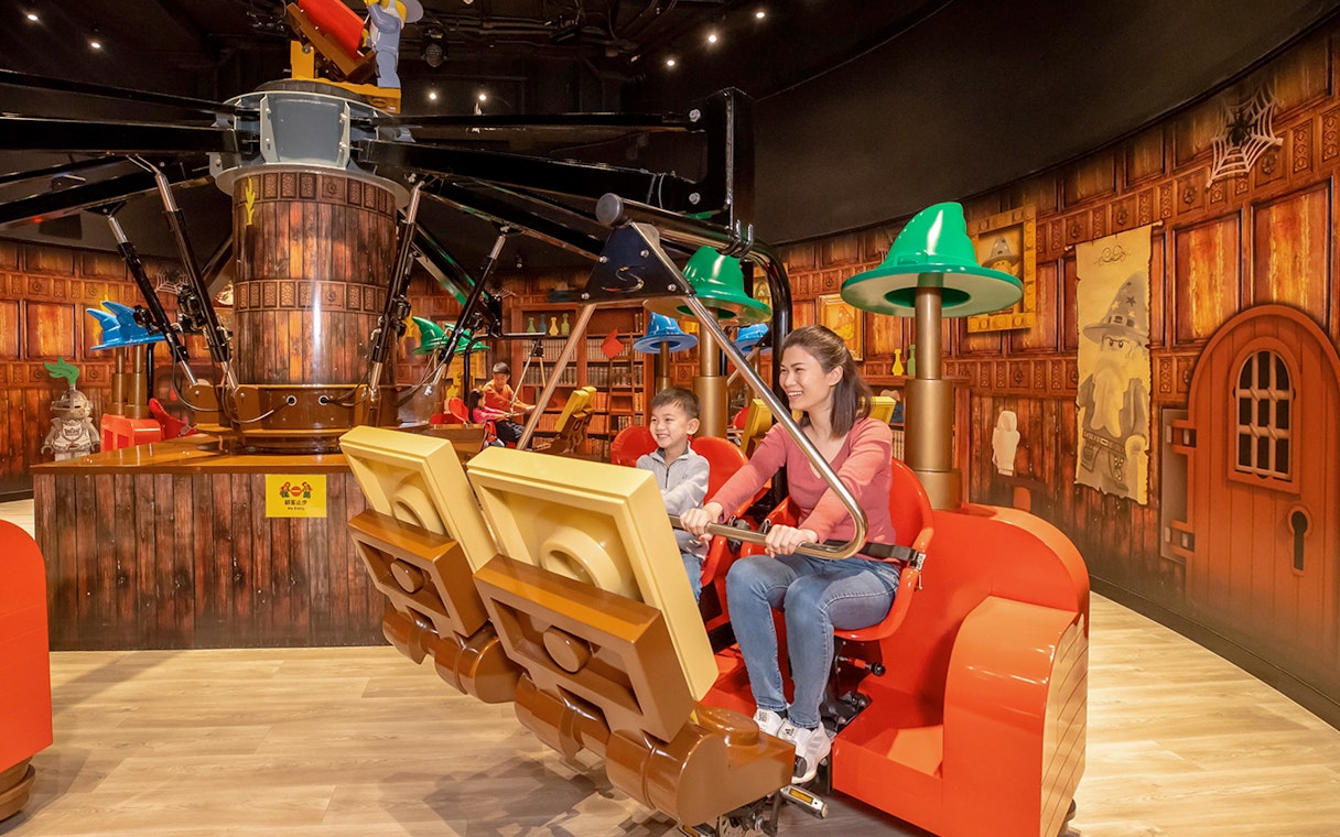 Family enjoying a ride at LEGOLAND® Discovery Centre Hong Kong.