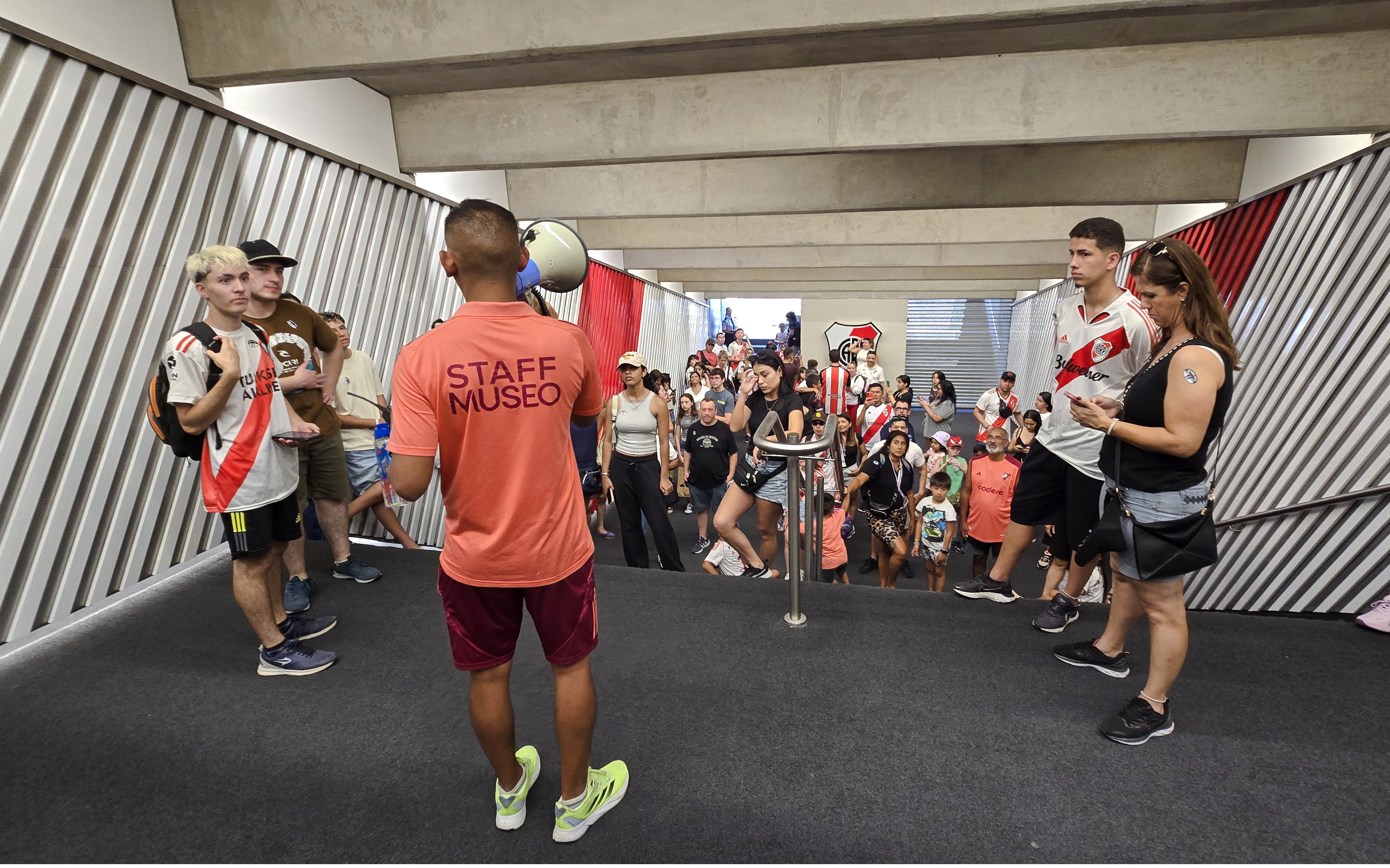 Group touring the tunnel of Estadio Mâs Monumental, Buenos Aires, Argentina.