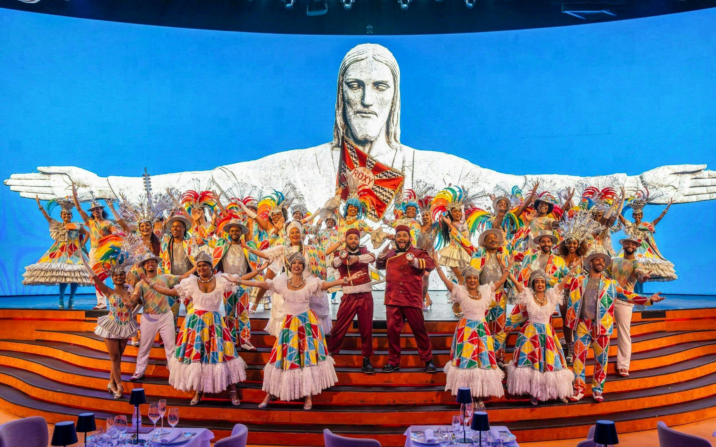 Performers in colorful costumes on stage at Roxy Dinner Show, Rio de Janeiro.