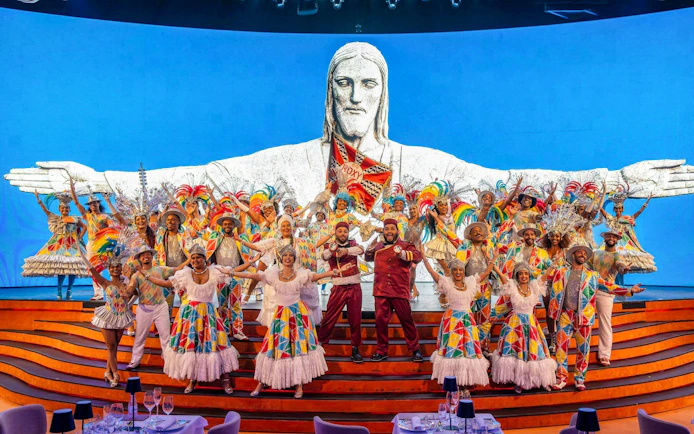 Performers in colorful costumes on stage at Roxy Dinner Show, Rio de Janeiro.