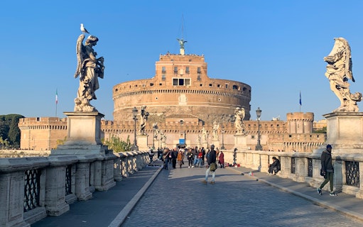 Castel Sant'Angelo and statues on the bridge during a 3-hour guided bike tour of Rome.