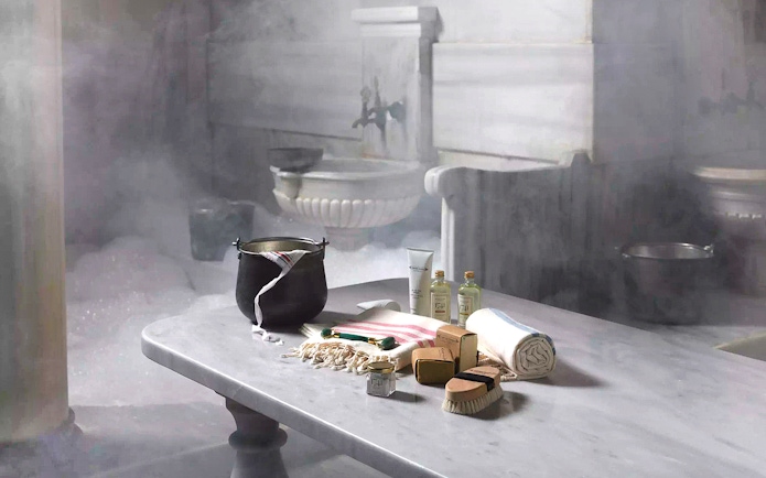 Cagaloglu Hammam interior with traditional bathing items on a marble table, Istanbul.