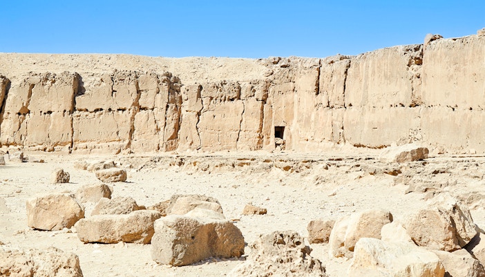 Ancient stone wall and ruins near the Pyramid of Khafre at Giza, Egypt.