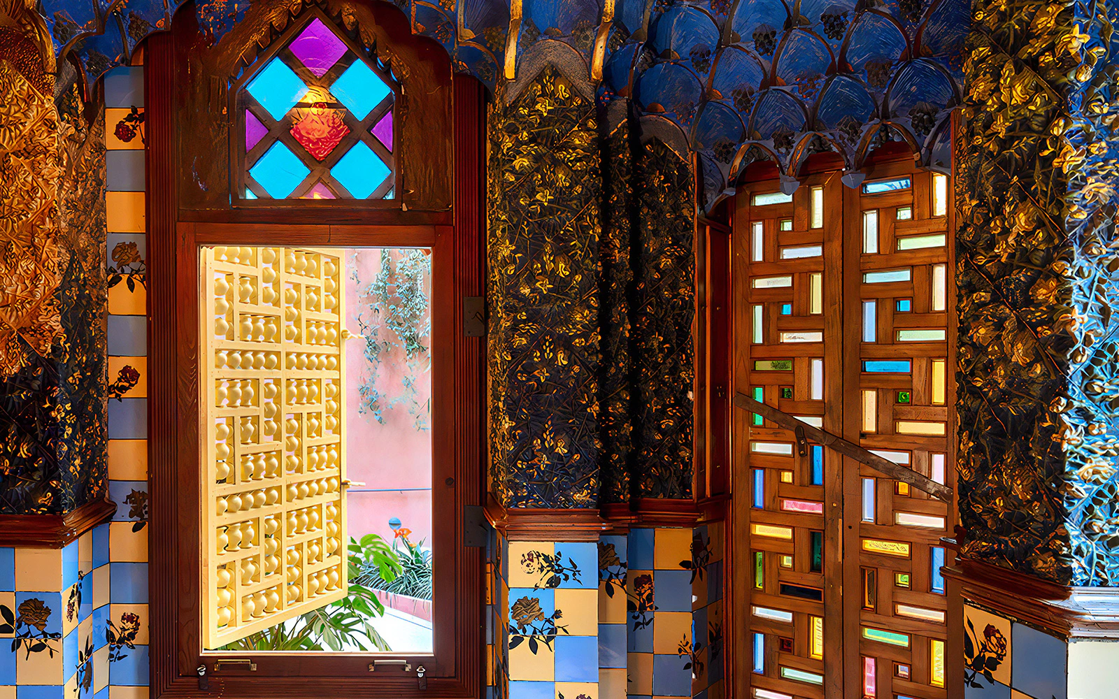 Casa Vicens interior with colorful stained glass and intricate tile patterns.