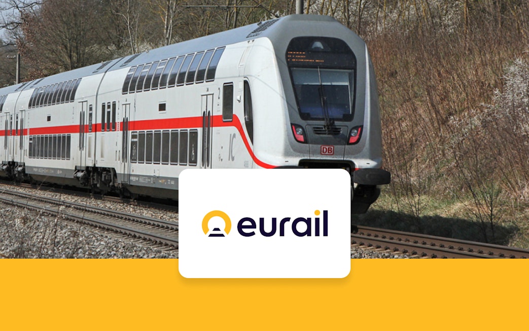 Eurail train on tracks in Germany with Eurail logo.
