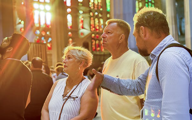 Tourists inside Sagrada Familia, Barcelona, during a guided tour.