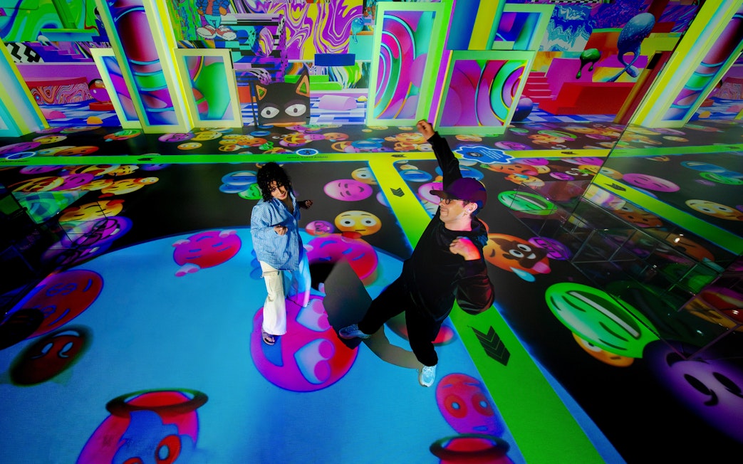 Visitors enjoying vibrant digital art projections at House Of Hype.