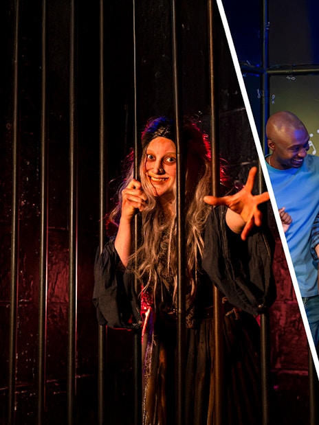 London Dungeon actor behind bars and visitors with wax figure at Madame Tussauds.
