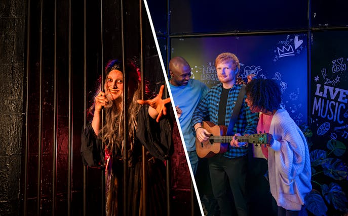 London Dungeon actor behind bars and visitors with wax figure at Madame Tussauds.
