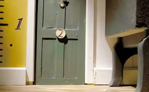 Door with number two in Alice in Puzzleland escape room, Dubai.