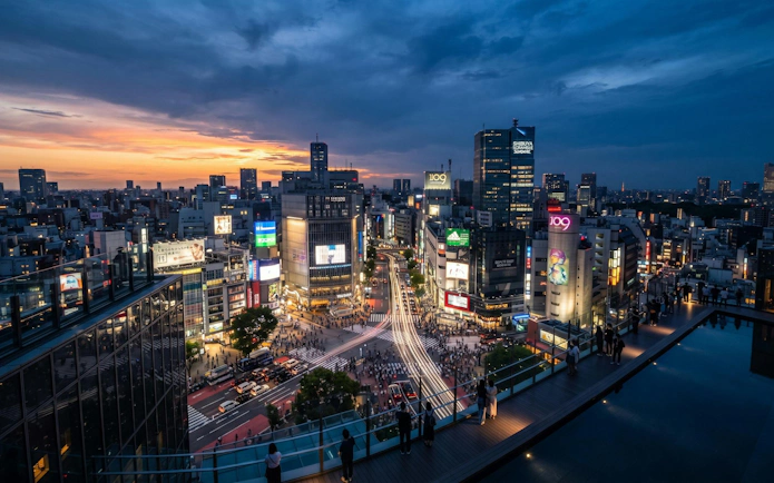 Shibuya Scramble Crossing and city skyline at dusk from SHIBUYA SKY, Tokyo.