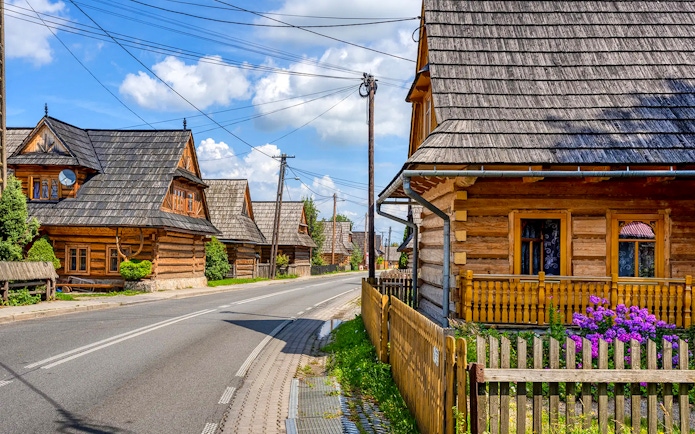 Traditional wooden houses along a street in Zakopane, Poland.
