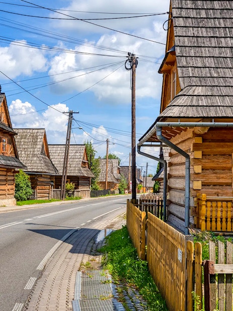 Traditional wooden houses along a street in Zakopane, Poland.