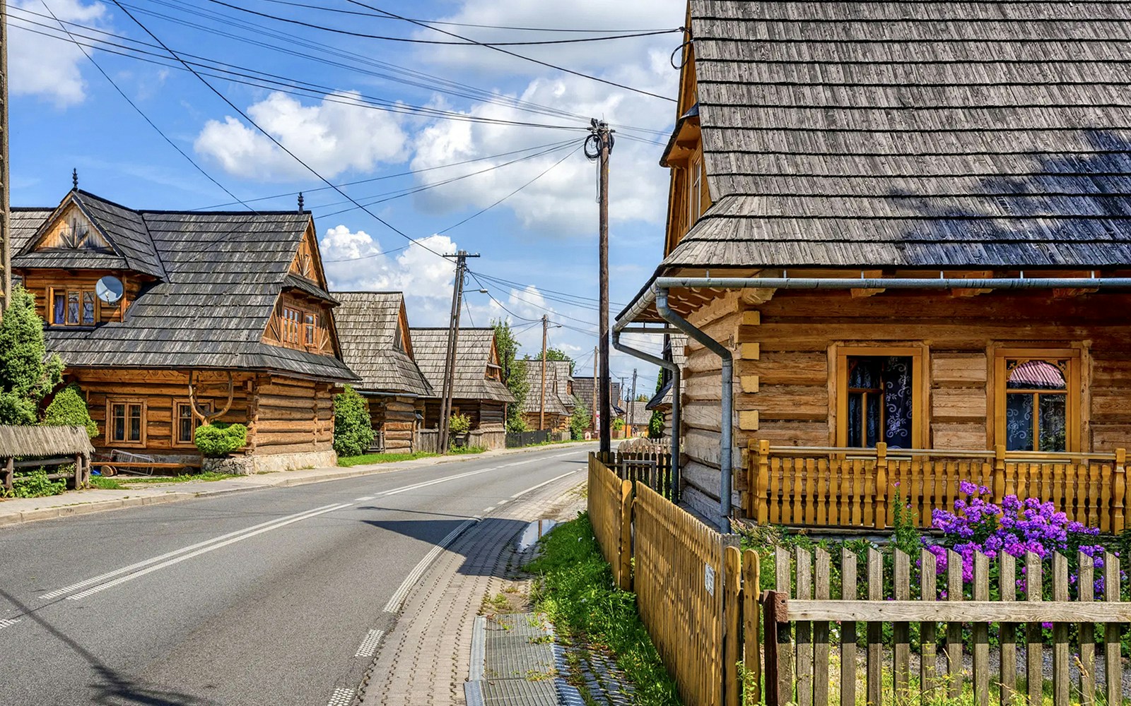 Traditional wooden houses along a street in Zakopane, Poland.