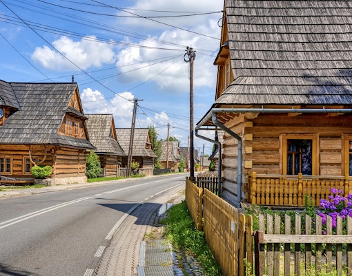 Traditional wooden houses along a street in Zakopane, Poland.