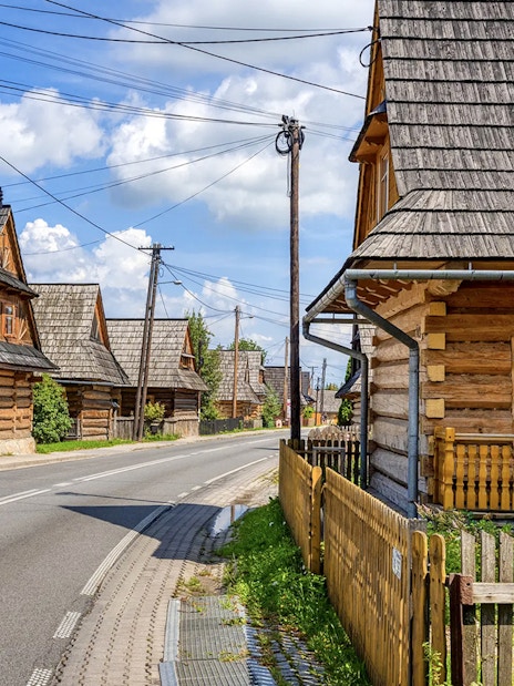 Traditional wooden houses along a street in Zakopane, Poland.