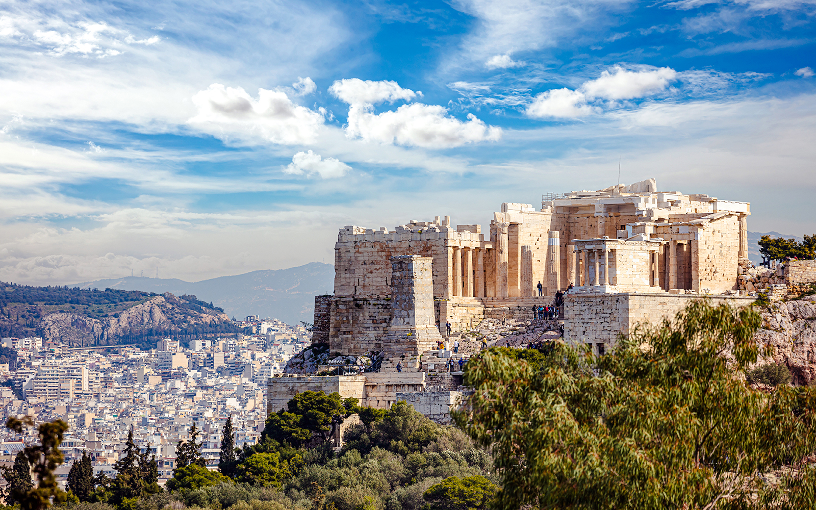 Acropolis view from Philopappos Hill, Athens, showcasing ancient ruins and cityscape.